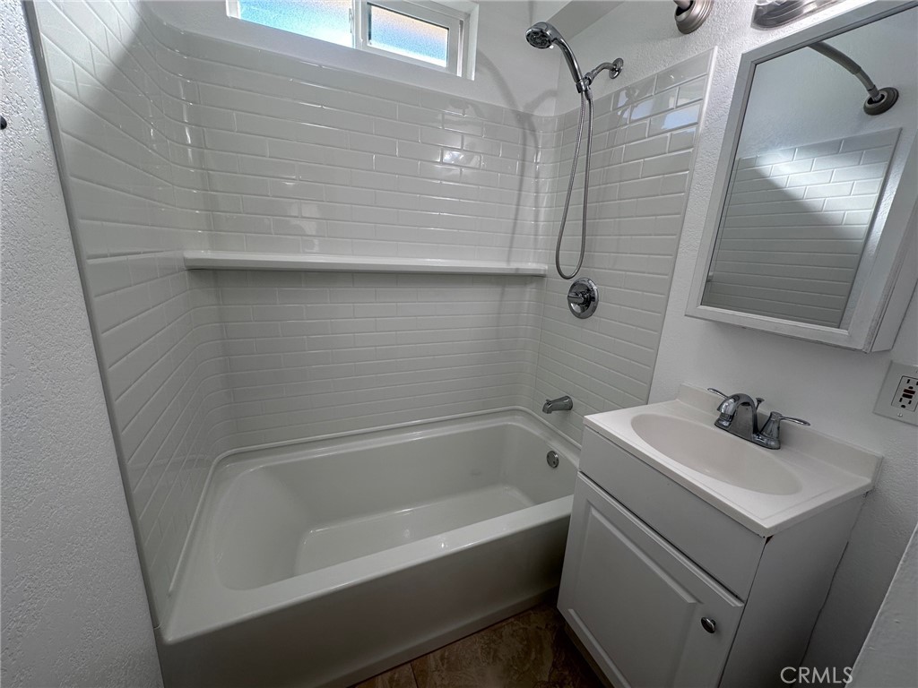 318 East Walnut Street, Unit B Santa Ana, CA 92701 - Photo 8 of 9 a bathroom with a sink a toilet and shower