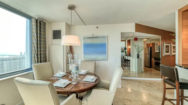 a living room with furniture and a mirror