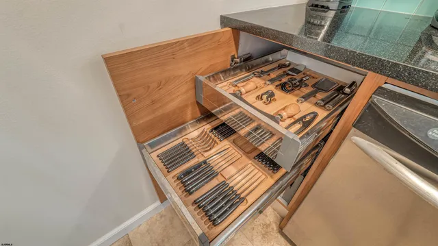 a kitchen with stainless steel appliances a refrigerator and a stove