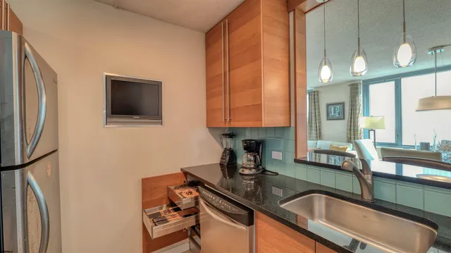 a bedroom with furniture and a large window