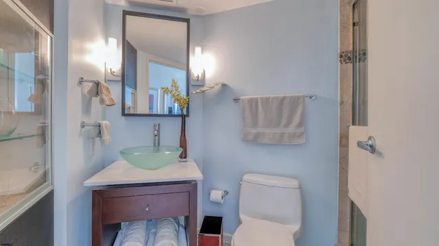 a view of walk in closet with clothes