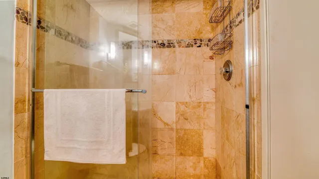 a bedroom with a bed and a desk