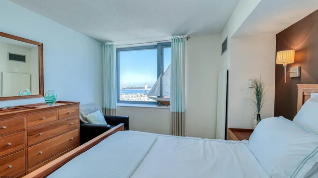 a bedroom with a bed and a dresser