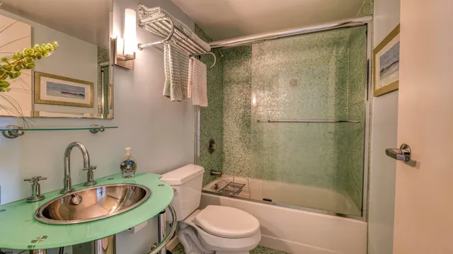 a view of a chairs and table in a balcony