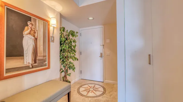 a view of dining room with wooden floor and chairs