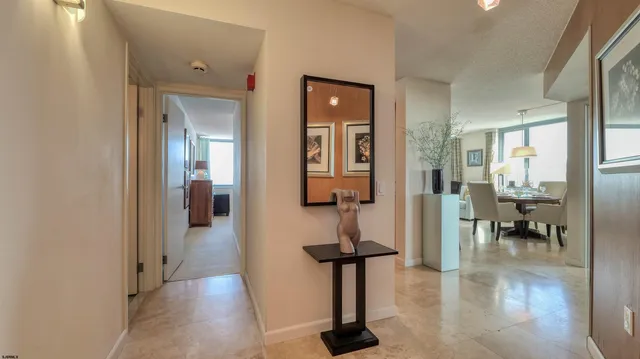 a living room with furniture and a lamp