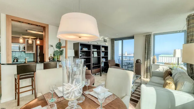 a living room with furniture and a book shelf