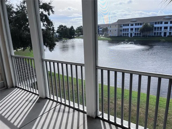 a view of a balcony with wooden floor