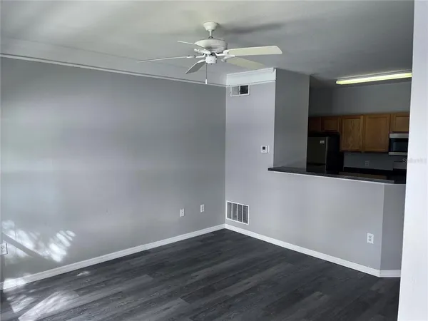 a view of a livingroom with wooden floor