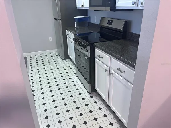 a kitchen with a sink and a stove