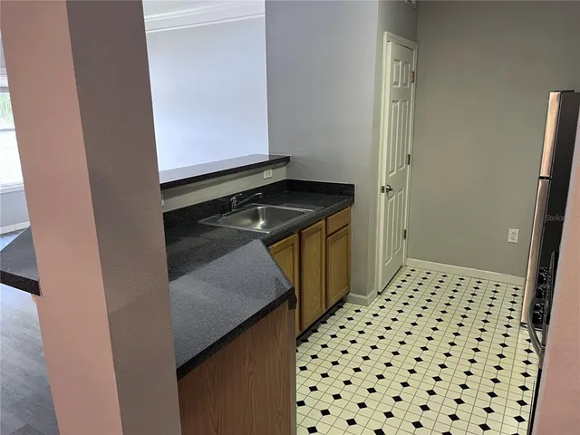 a bathroom with a sink a toilet and a shower