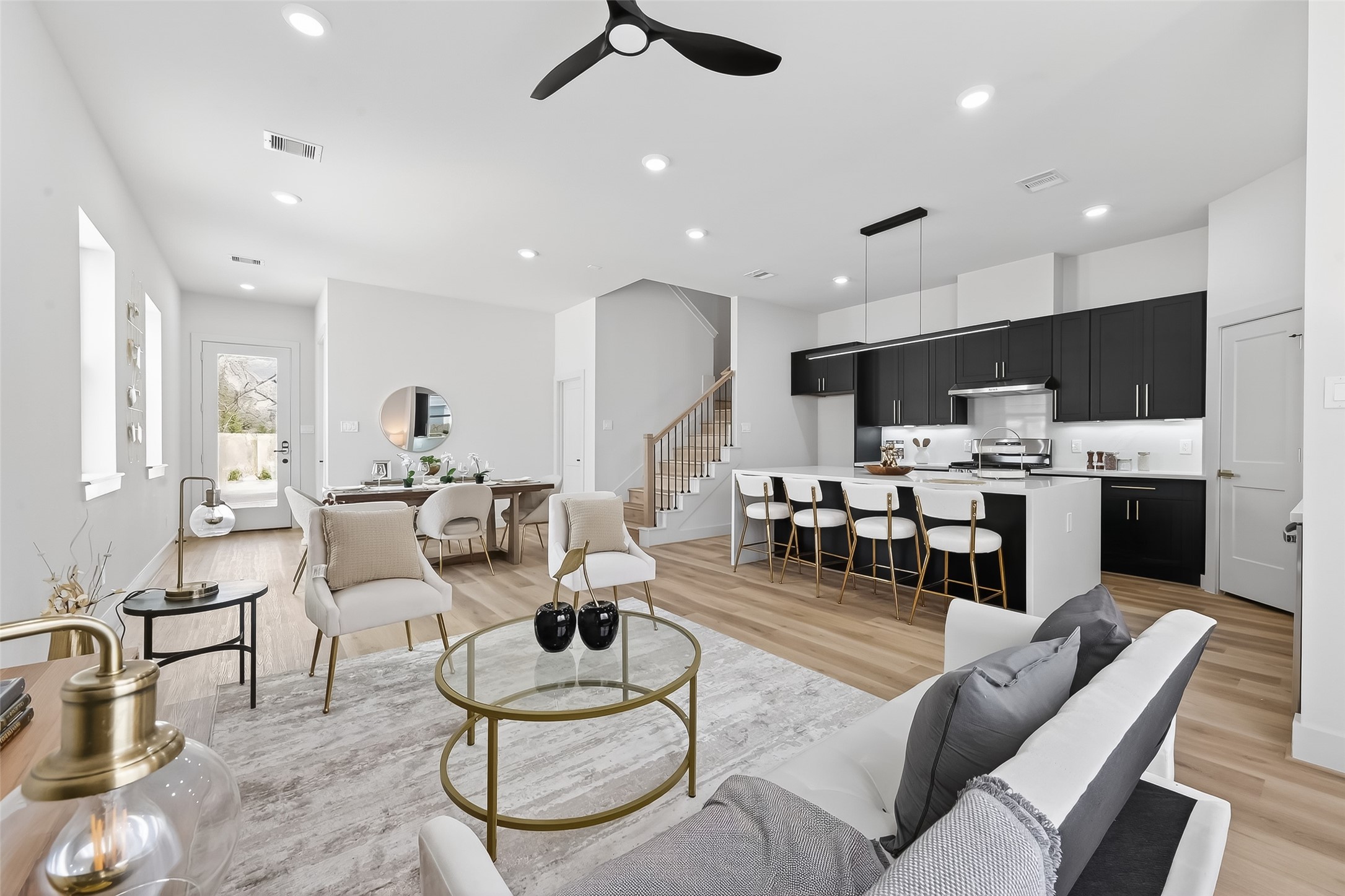 975 Highland Light Lane Houston, TX 77091 - Photo 11 of 41 a living room with furniture kitchen view and a wooden floor