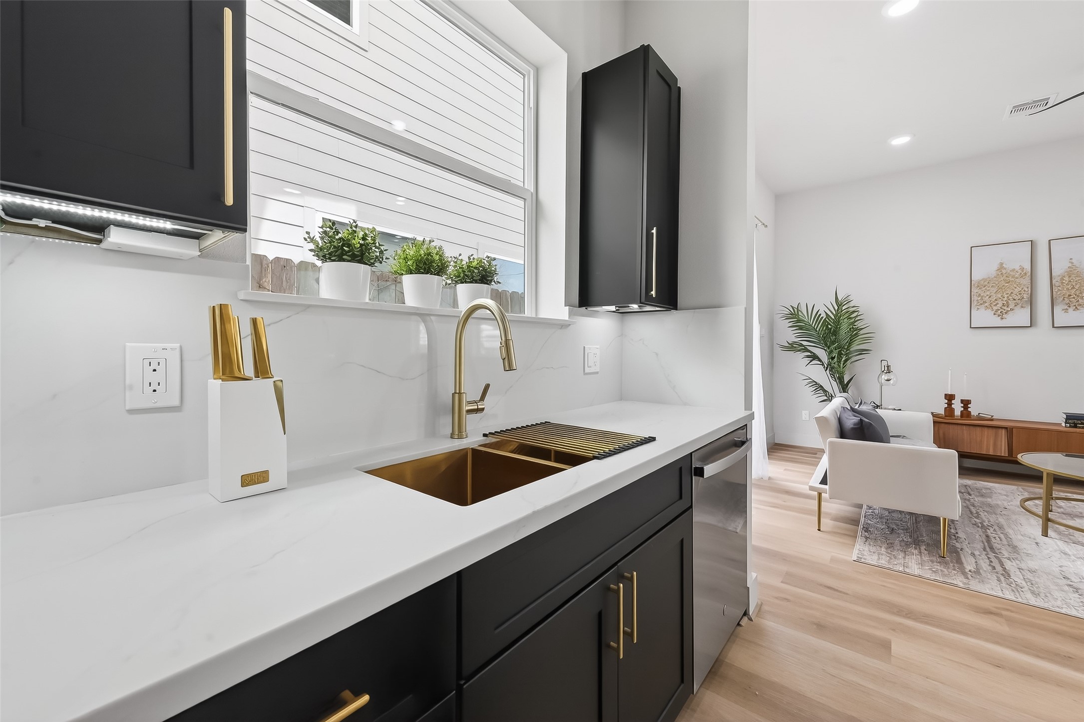 975 Highland Light Lane Houston, TX 77091 - Photo 15 of 41 a kitchen with a sink and a refrigerator