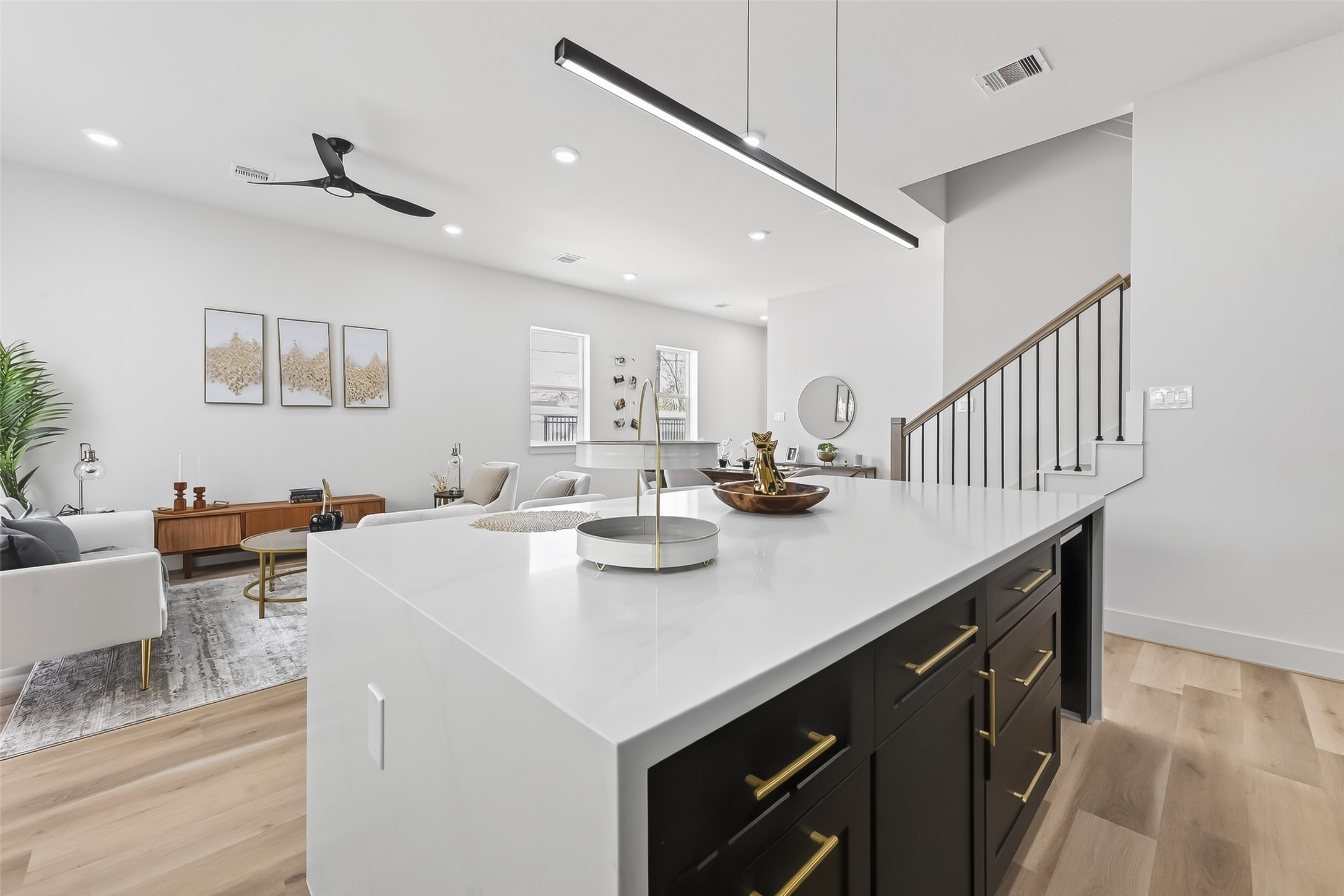 975 Highland Light Lane Houston, TX 77091 - Photo 16 of 41 a view of kitchen island a sink wooden floor dining table and chairs