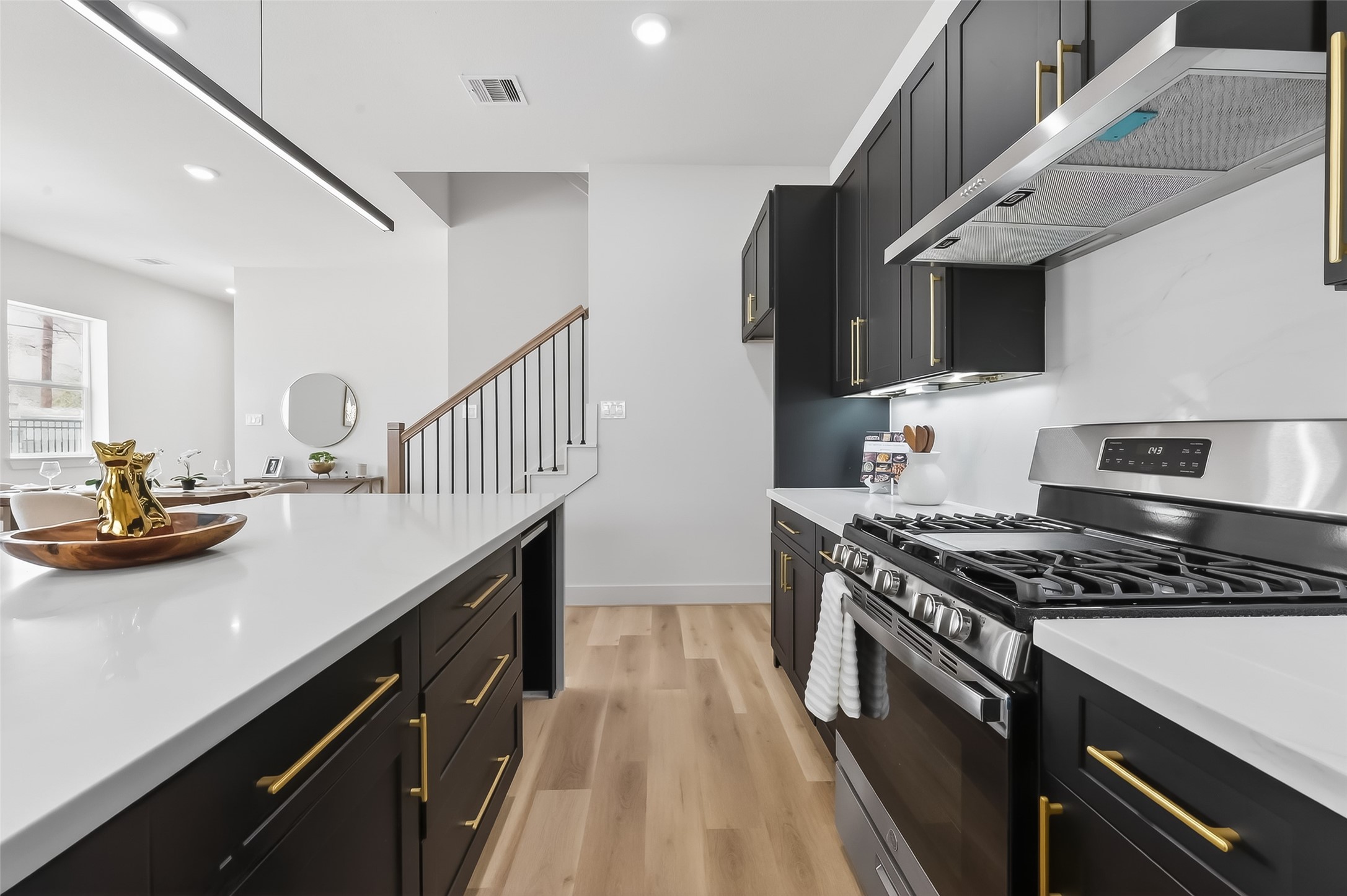 975 Highland Light Lane Houston, TX 77091 - Photo 17 of 41 a kitchen with granite countertop a stove and a sink