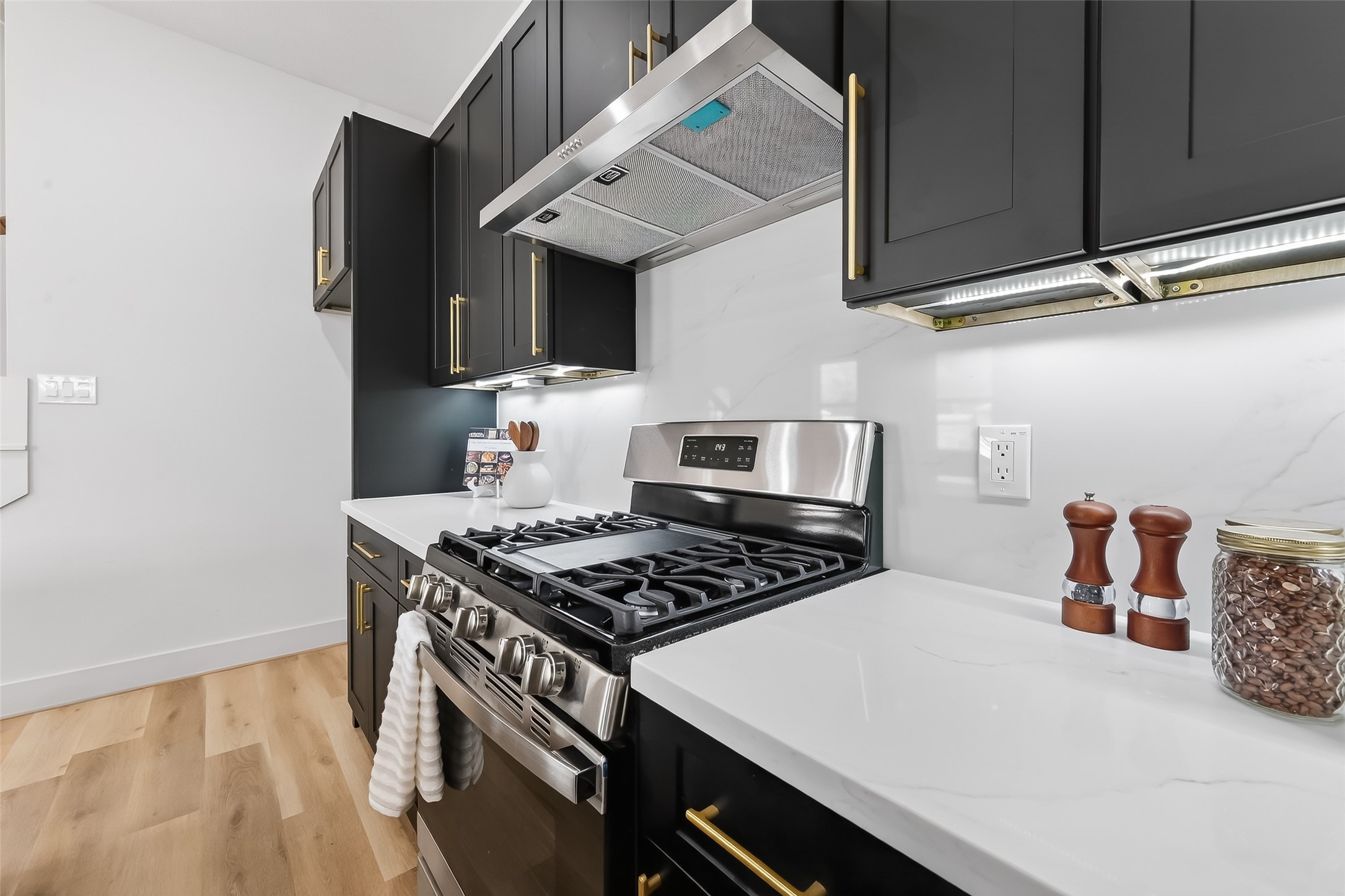 975 Highland Light Lane Houston, TX 77091 - Photo 18 of 41 a kitchen with a stove and a refrigerator