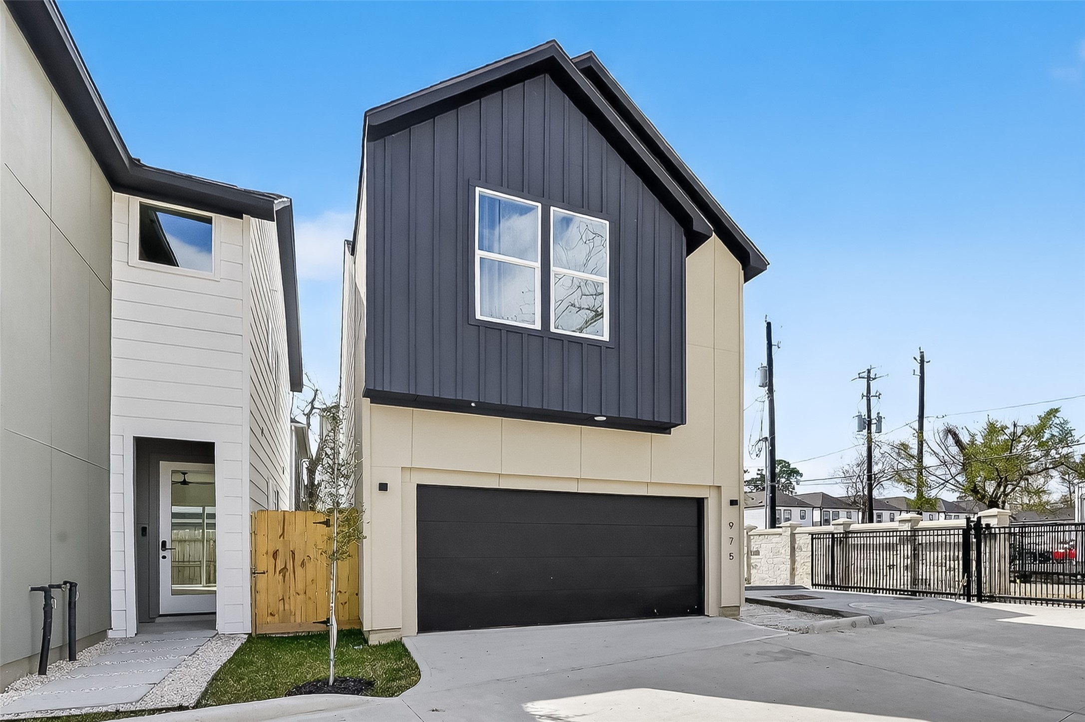975 Highland Light Lane Houston, TX 77091 - Photo 2 of 41 a front view of a house with a yard