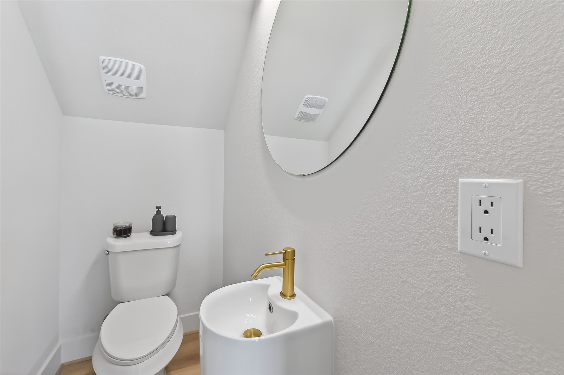 975 Highland Light Lane Houston, TX 77091 - Photo 22 of 41 a white toilet sitting next to a bathroom sink