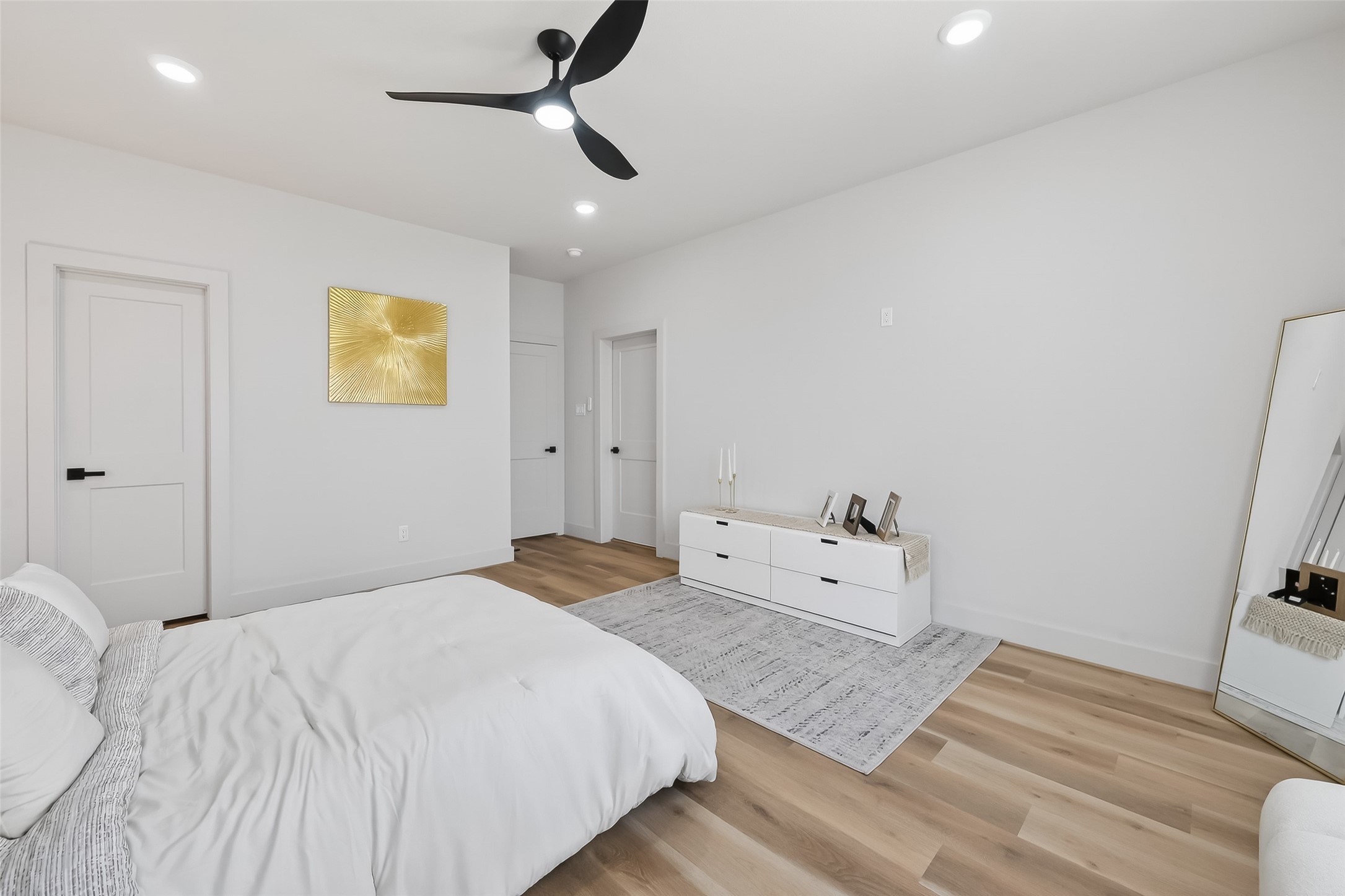 975 Highland Light Lane Houston, TX 77091 - Photo 25 of 41 a bedroom with a bed and wooden floor