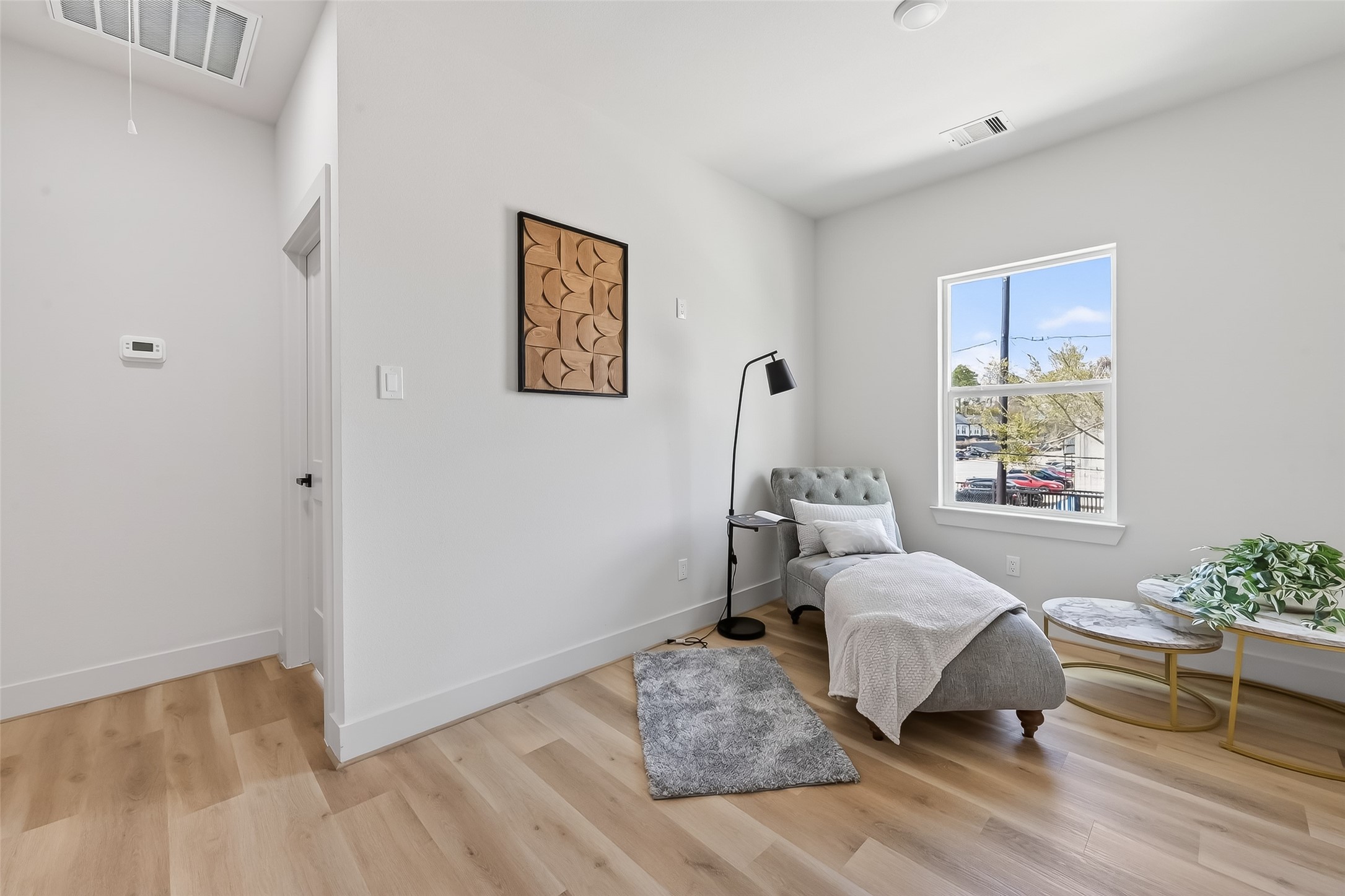 975 Highland Light Lane Houston, TX 77091 - Photo 30 of 41 a bedroom with a bed and wooden floor