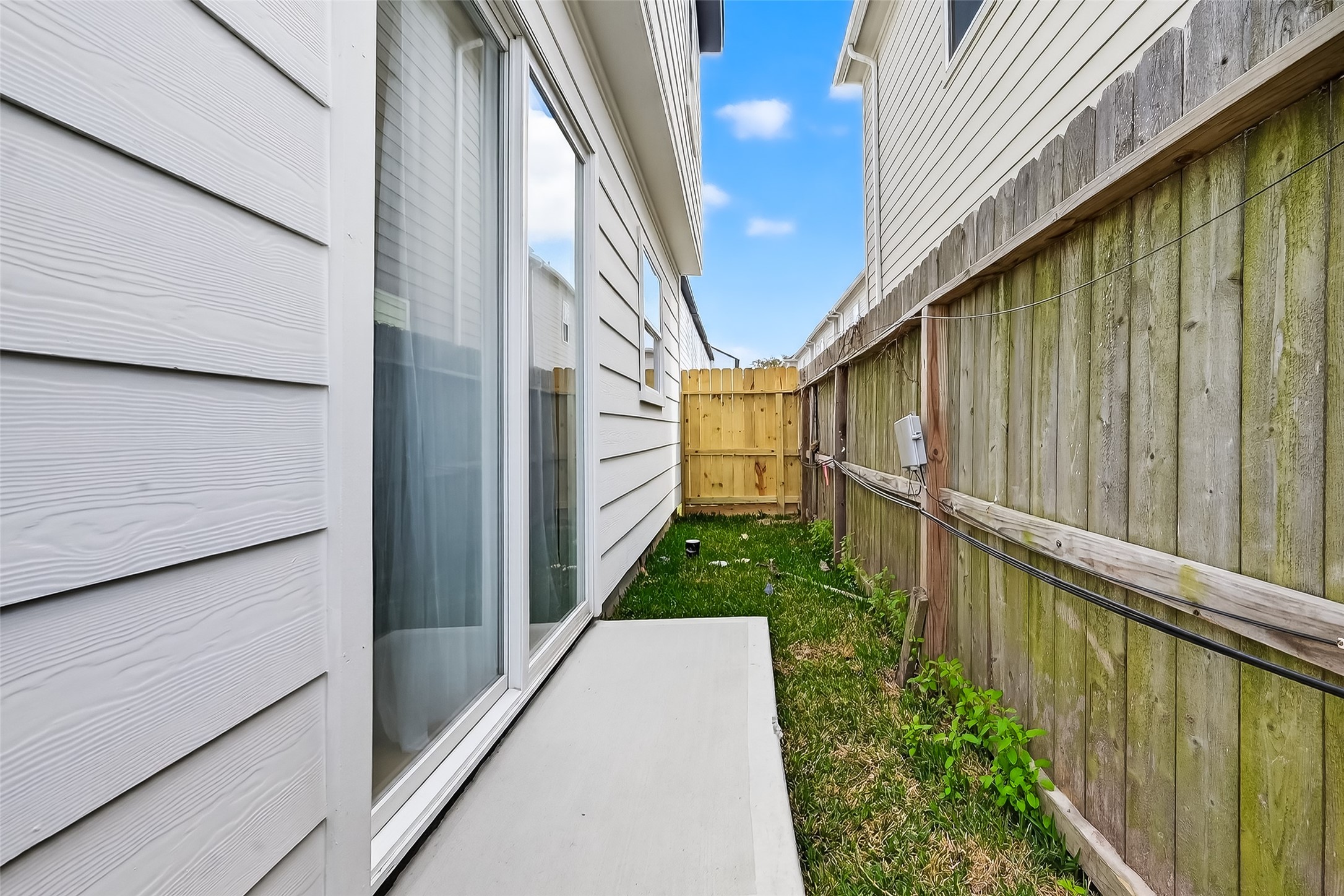975 Highland Light Lane Houston, TX 77091 - Photo 40 of 41 a view of a pathway of a balcony with wooden fence
