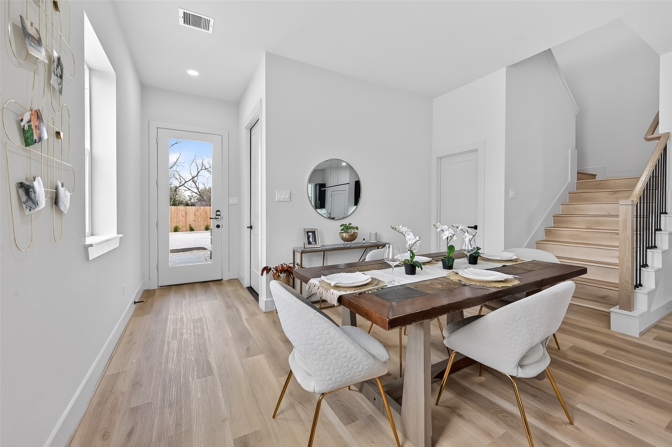 975 Highland Light Lane Houston, TX 77091 - Photo 4 of 41 a view of a dining room with furniture and wooden floor