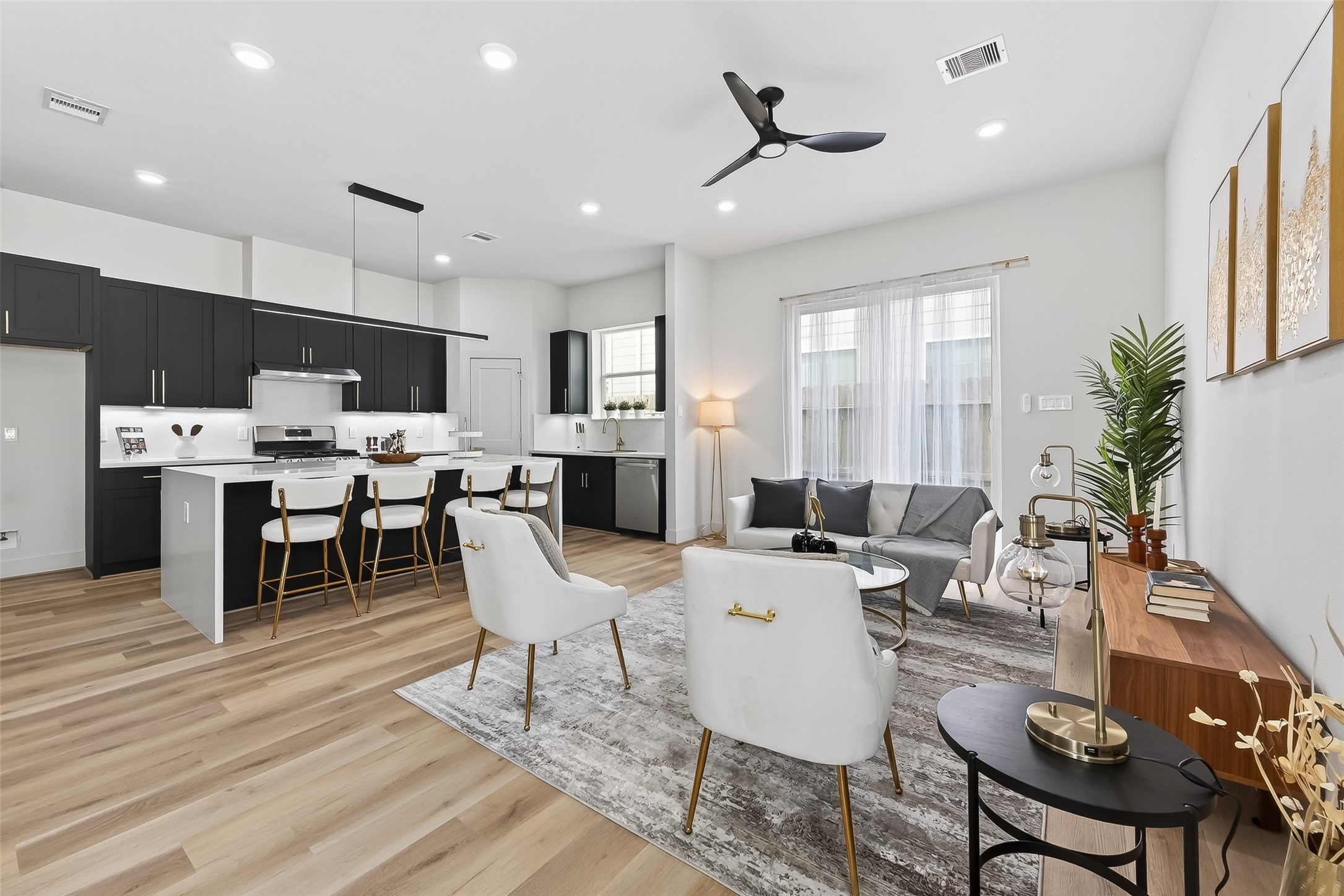 975 Highland Light Lane Houston, TX 77091 - Photo 8 of 41 a living room with furniture a large window and kitchen view