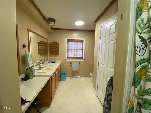 23 South Chaucer Way Kittrell, NC 27544 - Photo 15 of 28 a en suite bathroom with sink a mirror a bathtub and shower