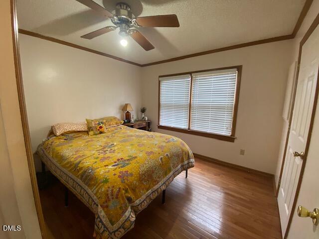23 South Chaucer Way Kittrell, NC 27544 - Photo 16 of 28 a bed sitting in a spacious bedroom next to a window
