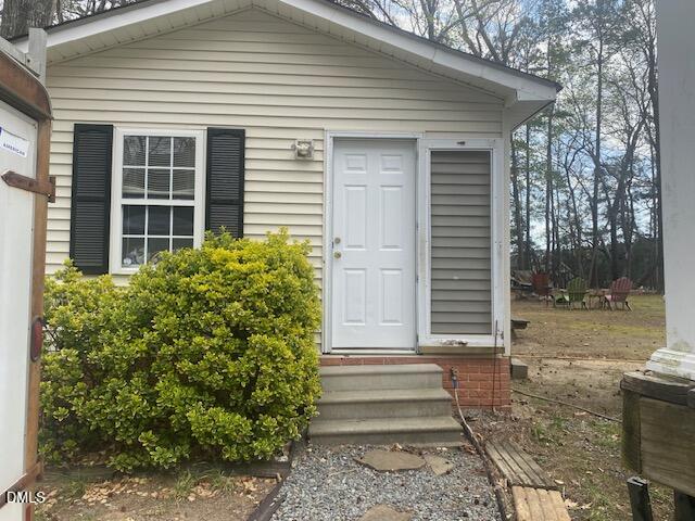 23 South Chaucer Way Kittrell, NC 27544 - Photo 23 of 28 a front view of a house with garden