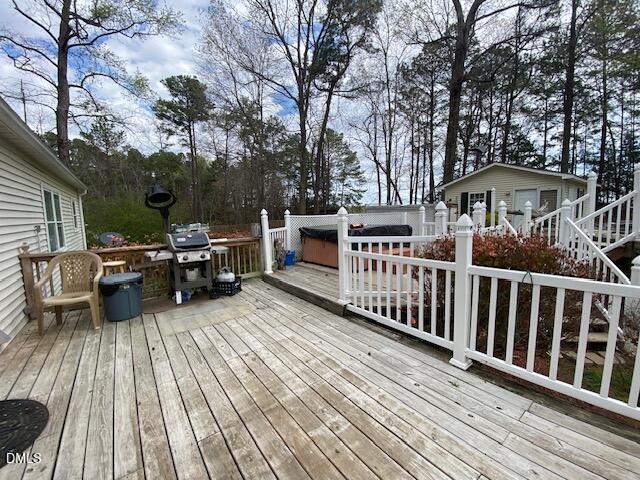 23 South Chaucer Way Kittrell, NC 27544 - Photo 25 of 28 a view of a wooden chairs and table on the deck