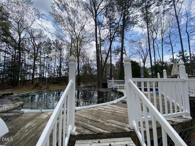 23 South Chaucer Way Kittrell, NC 27544 - Photo 26 of 28 a view of a wooden deck and lake