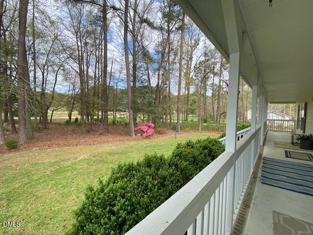 23 South Chaucer Way Kittrell, NC 27544 - Photo 3 of 28 a view of a bench in a balcony