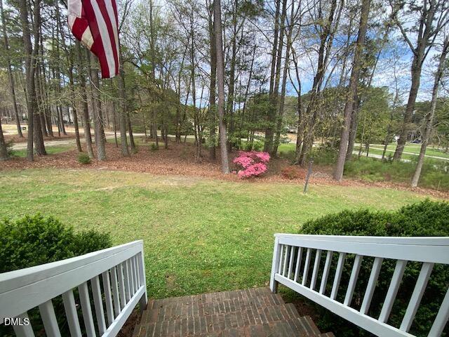 23 South Chaucer Way Kittrell, NC 27544 - Photo 4 of 28 a view of backyard from deck having patio