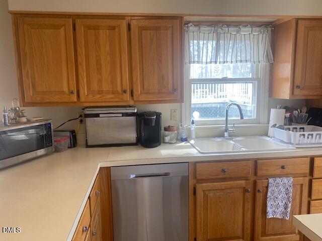 23 South Chaucer Way Kittrell, NC 27544 - Photo 7 of 28 a kitchen with stainless steel appliances granite countertop a sink a stove and a microwave