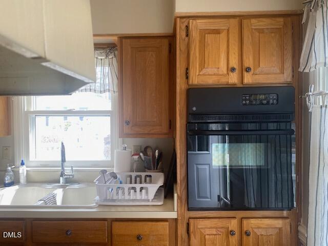 23 South Chaucer Way Kittrell, NC 27544 - Photo 8 of 28 a kitchen with granite countertop a sink and a window