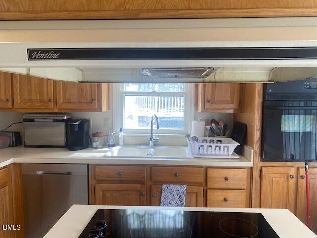 23 South Chaucer Way Kittrell, NC 27544 - Photo 10 of 28 a kitchen with stainless steel appliances granite countertop a sink stove and cabinets