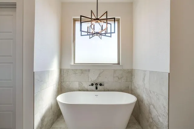 a white bath tub sitting in a bathroom