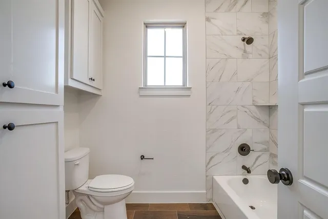 a bathroom with a sink a toilet and a bathtub