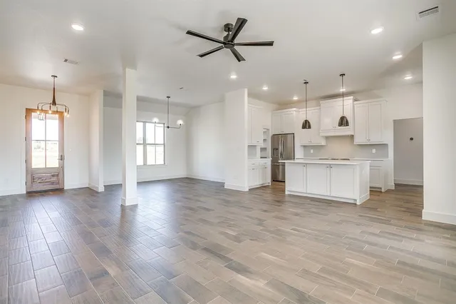 a view of a kitchen with a sink and a window