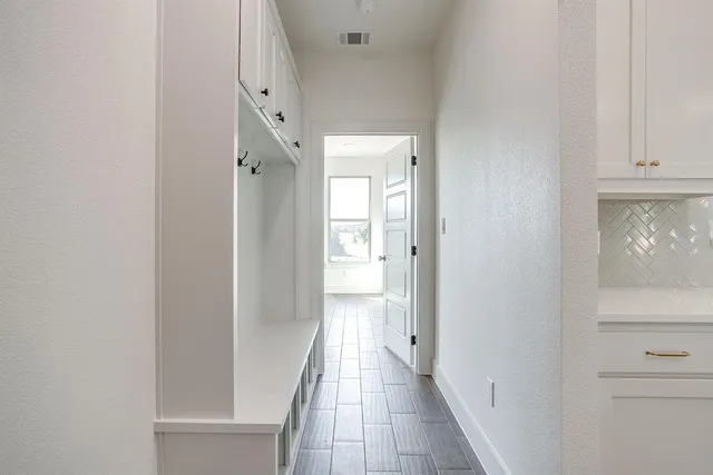 a view of a bathroom from the hallway