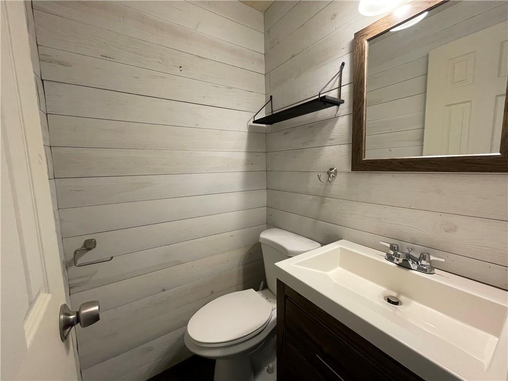659 Meadow Lane Rochester, PA 15074 - Photo 7 of 23 a bathroom with a sink toilet and mirror