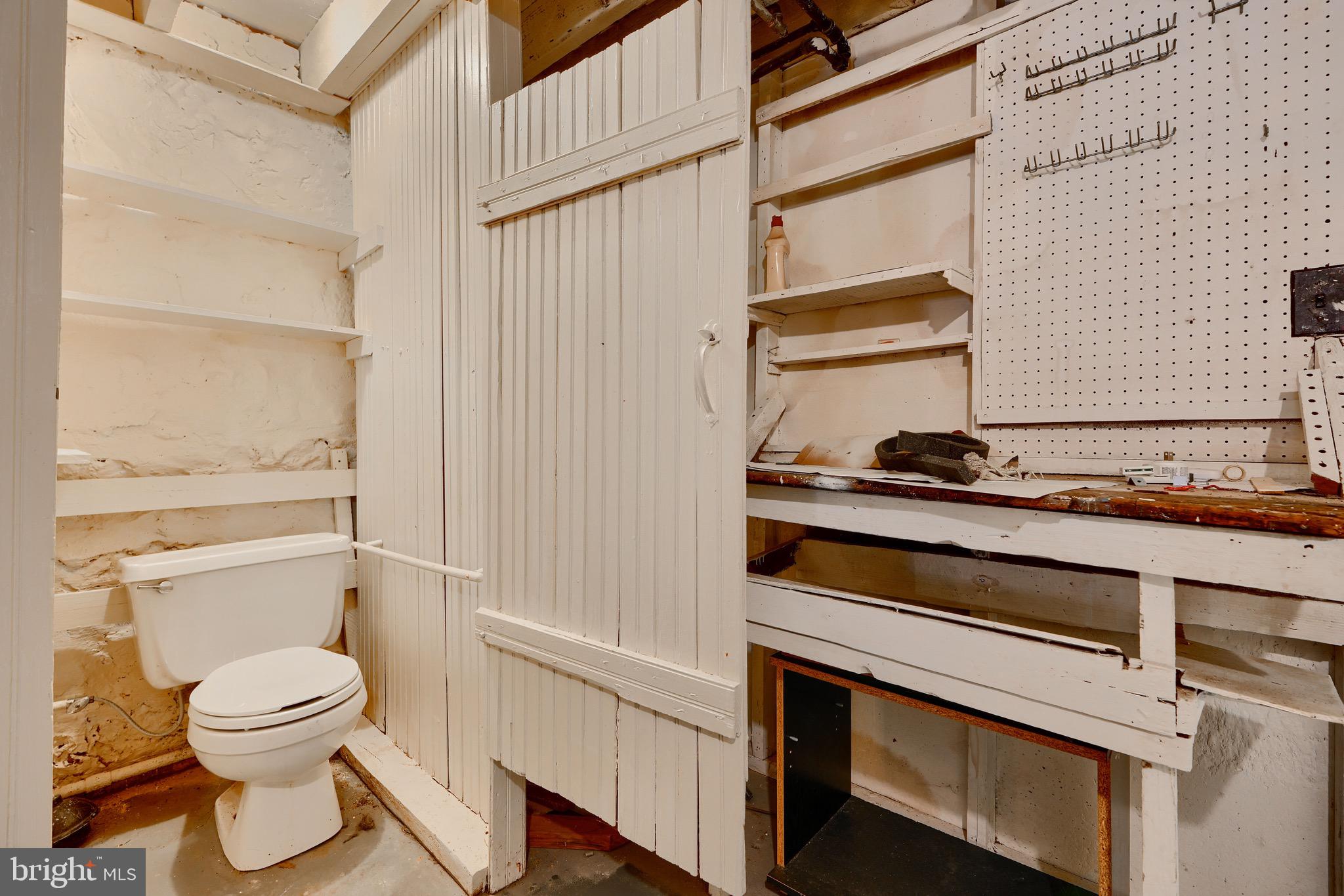 3753 Keswick Road Baltimore, MD 21211 - Photo 32 of 36 a bathroom with a toilet and a sink