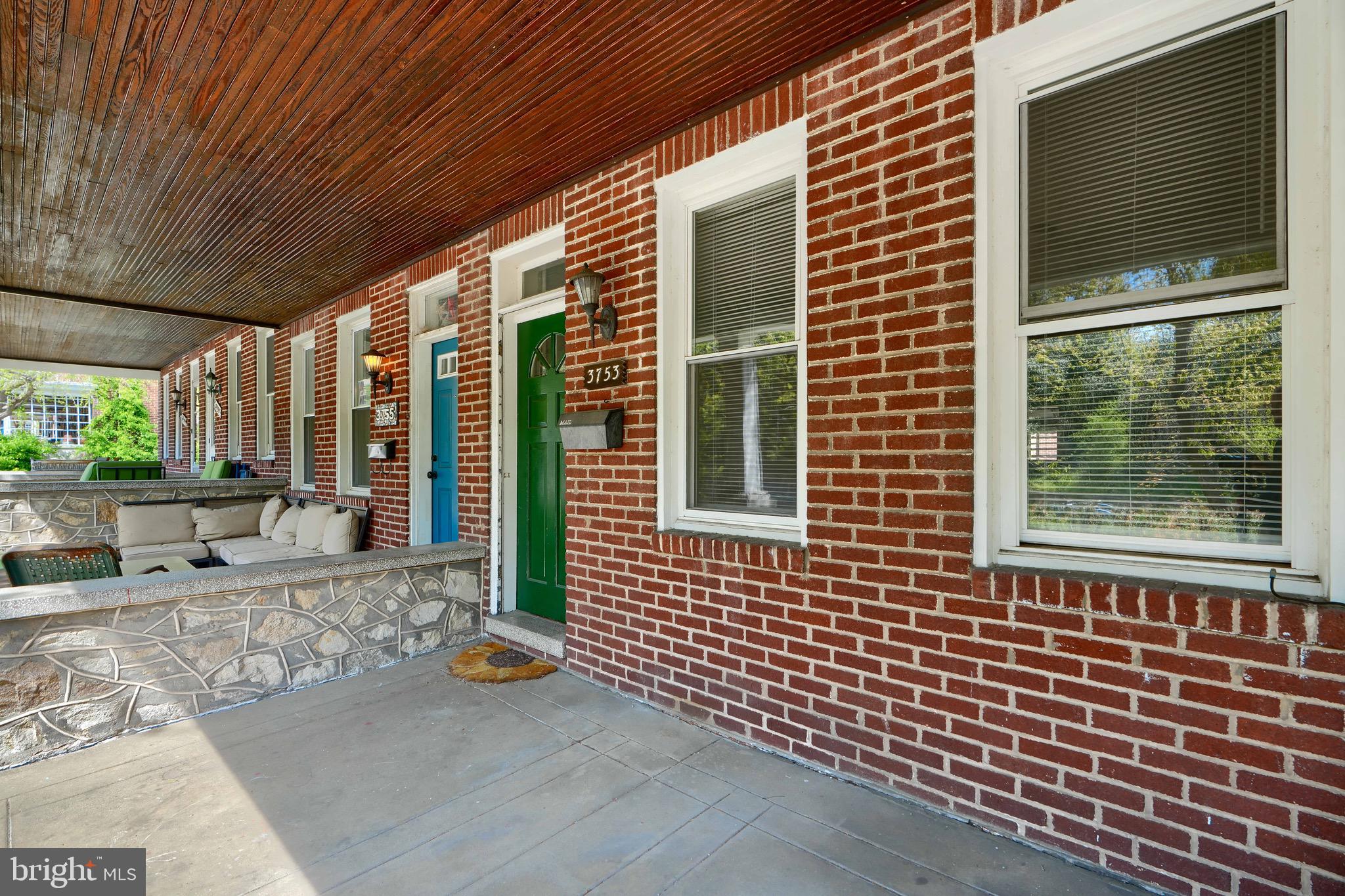 3753 Keswick Road Baltimore, MD 21211 - Photo 4 of 36 a view of a brick house with a large window
