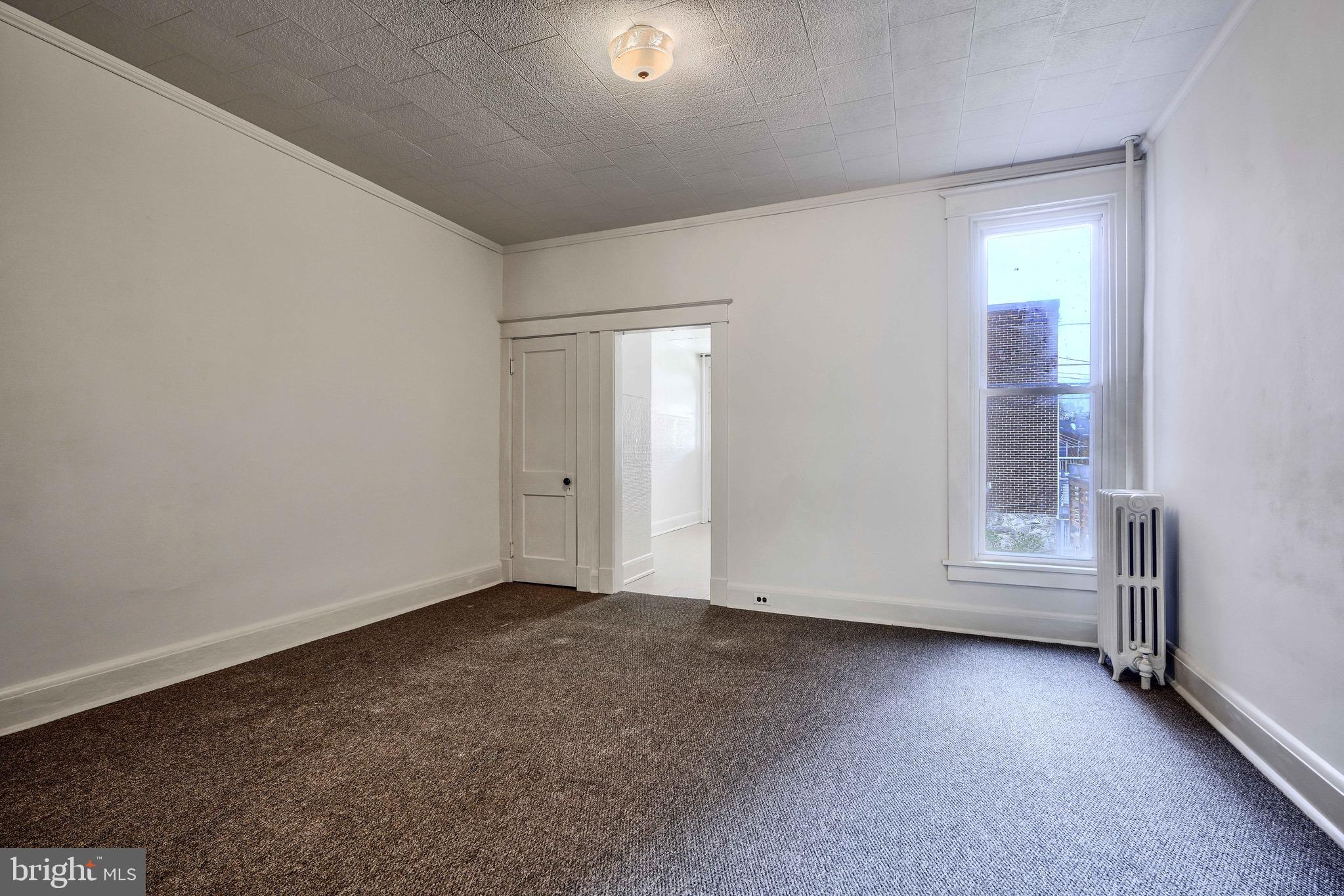 3753 Keswick Road Baltimore, MD 21211 - Photo 9 of 36 an empty room with a empty space and a window