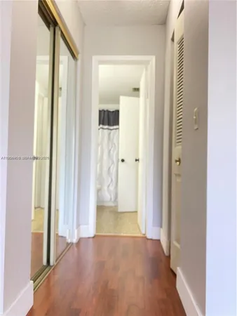 view of a bathroom with wooden floor and a bathroom