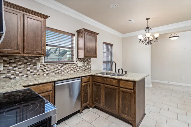 a kitchen with a sink stove and cabinets