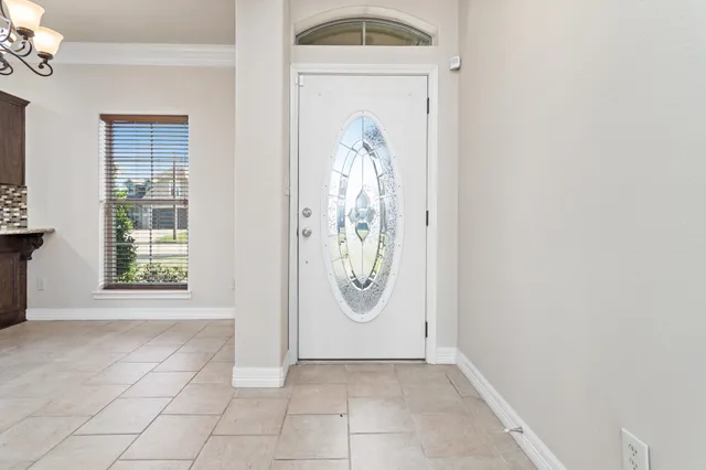 a view of a hallway with entryway window
