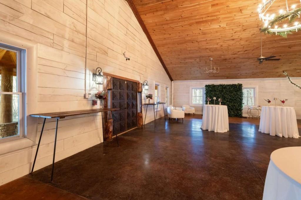 230 Old Mill White Road Jasper, GA 30143 - Photo 22 of 65 a view of a patio with table and chairs and couches with wooden floor