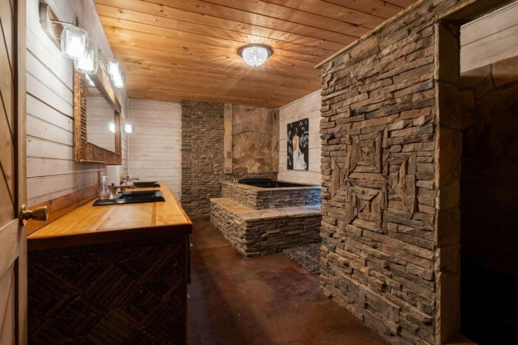 230 Old Mill White Road Jasper, GA 30143 - Photo 34 of 65 a bathroom with a sink and a mirror
